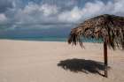 Varadero Beach, Cuba. The empty tropical beach clad with thatched umbrellas for tourists. Art Print